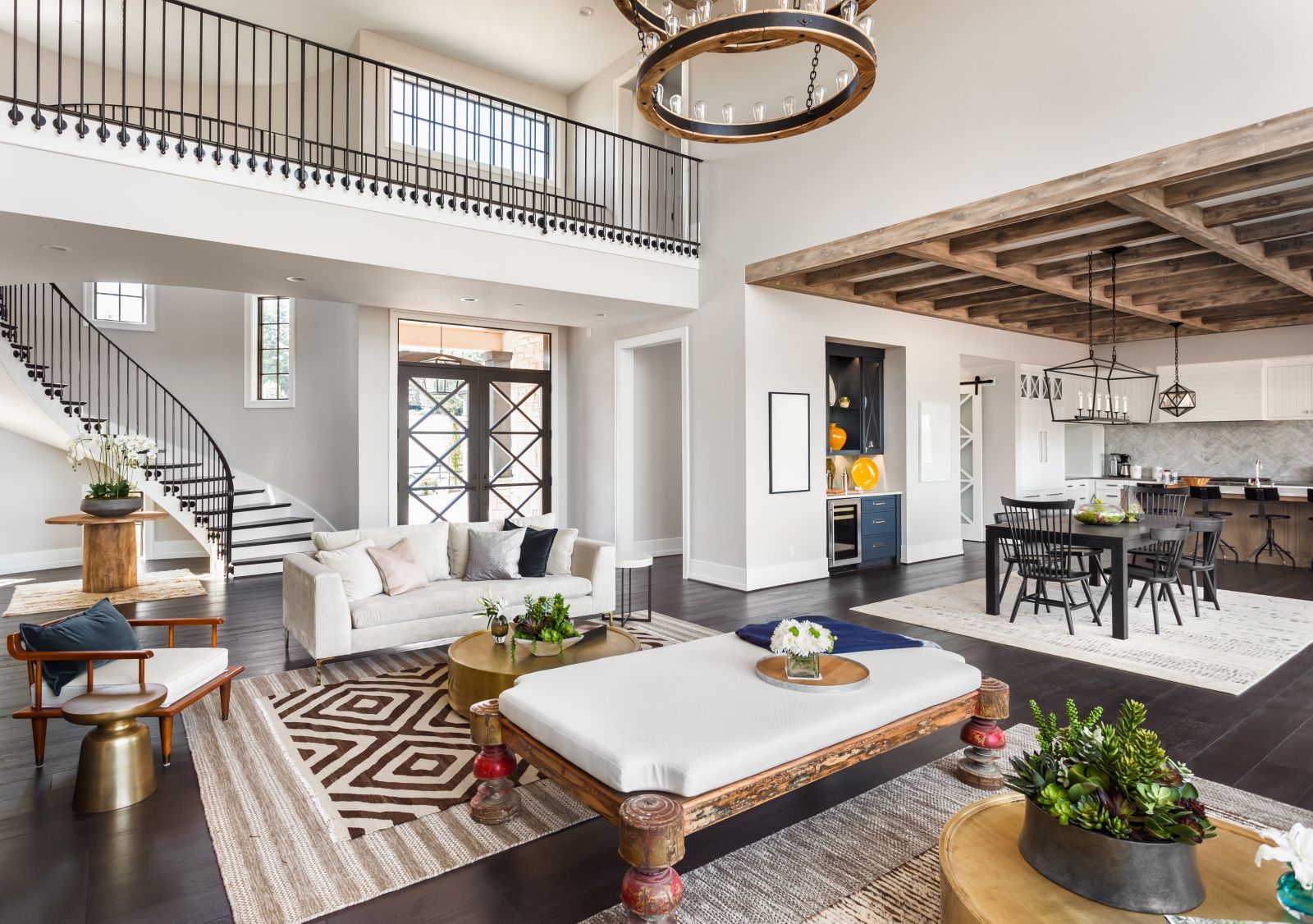Interior of modern mansion, showing entry, dining area, and living area.